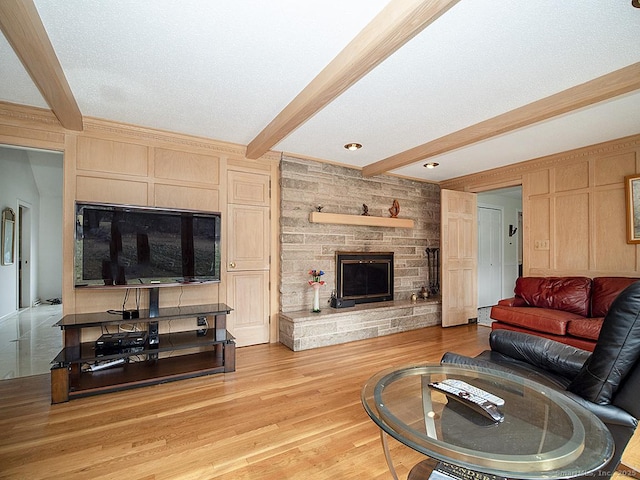 10 Edgehill Dr, Woodbridge, CT 06525 - living room featuring beamed ceiling, light wood finished floors, and a fireplace