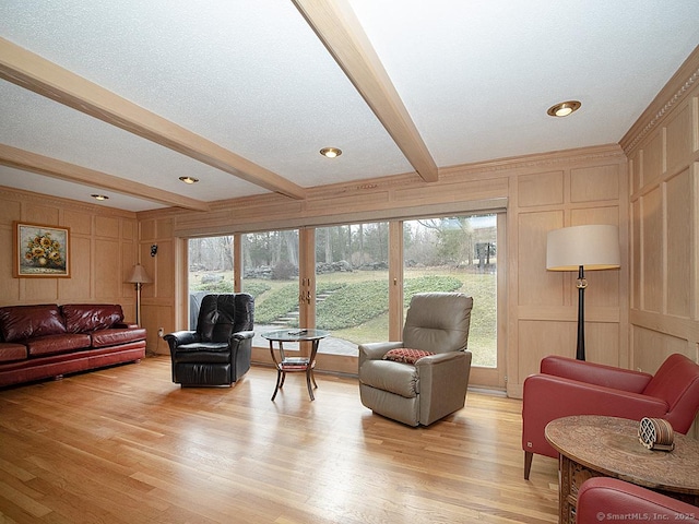 10 Edgehill Dr, Woodbridge, CT 06525 - living area with a decorative wall, beamed ceiling, and light wood-style floors