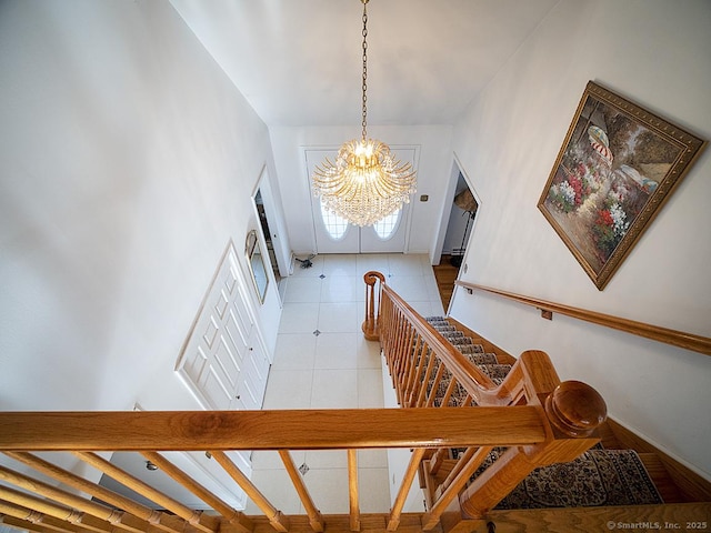 10 Edgehill Dr, Woodbridge, CT 06525 - staircase featuring a chandelier, tile patterned flooring, and baseboards