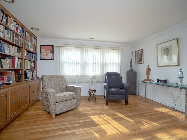 10 Edgehill Dr, Woodbridge, CT 06525 - sitting room with light wood finished floors, crown molding, and baseboards