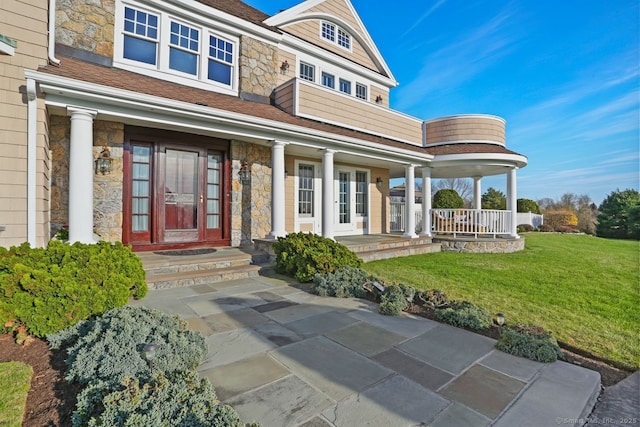 7 Long Meadow Ln, Redding, CT 06896 - entrance to property with a shingled roof, a yard, covered porch, and stone siding