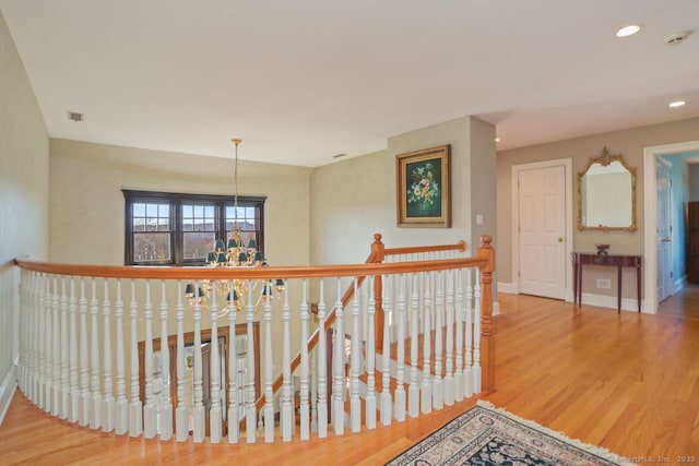 7 Long Meadow Ln, Redding, CT 06896 - hallway with an upstairs landing, wood finished floors, baseboards, a notable chandelier, and recessed lighting