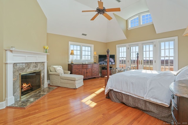 7 Long Meadow Ln, Redding, CT 06896 - bedroom featuring visible vents, a high end fireplace, wood finished floors, high vaulted ceiling, and access to outside