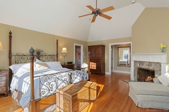 7 Long Meadow Ln, Redding, CT 06896 - bedroom featuring light wood-style floors, a premium fireplace, high vaulted ceiling, a ceiling fan, and baseboards
