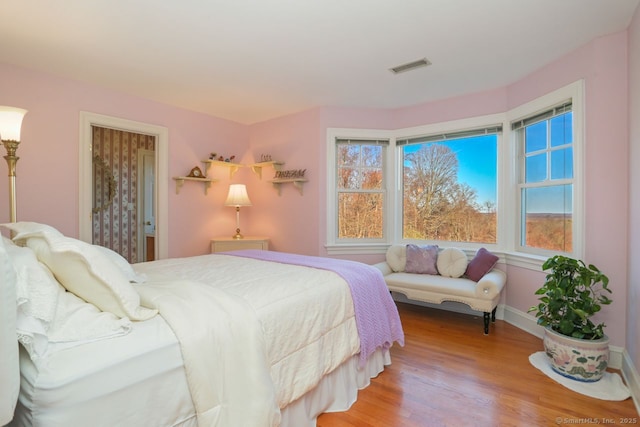 7 Long Meadow Ln, Redding, CT 06896 - bedroom featuring visible vents, baseboards, wood finished floors, and multiple windows