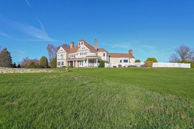 7 Long Meadow Ln, Redding, CT 06896 - view of front of house featuring fence, a chimney, and a front yard