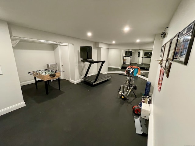 exercise area with recessed lighting and baseboards