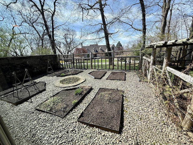 view of patio with a fenced backyard and a vegetable garden