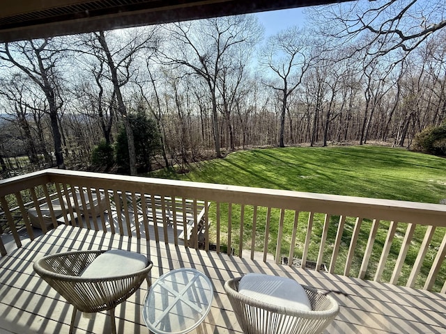 wooden terrace with a yard
