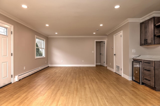 unfurnished living room with baseboard heating, wine cooler, light wood-style floors, recessed lighting, and baseboards