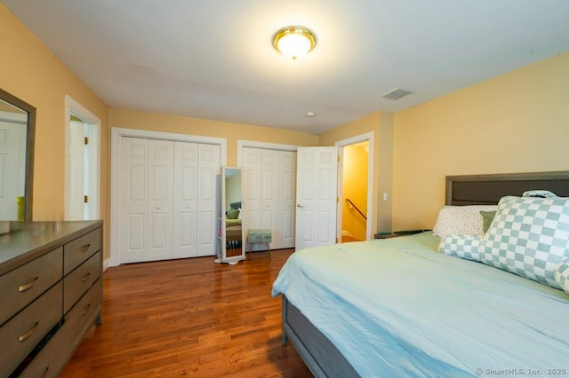 82 Summer St Unit A, Southington, CT 06489 - bedroom with visible vents, multiple closets, and dark wood-style floors