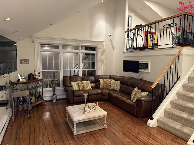 1314 Huntington Rd, Stratford, CT 06614 - living room featuring a baseboard radiator, recessed lighting, stairway, wood finished floors, and high vaulted ceiling