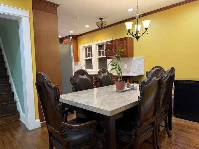 1314 Huntington Rd, Stratford, CT 06614 - dining room with baseboards, an inviting chandelier, ornamental molding, stairs, and dark wood finished floors