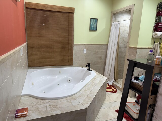 1314 Huntington Rd, Stratford, CT 06614 - full bath featuring tile walls, a jetted tub, a stall shower, and wainscoting