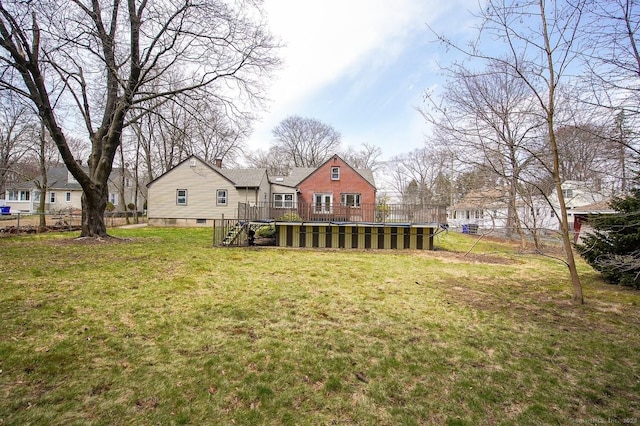 view of yard featuring a wooden deck and fence