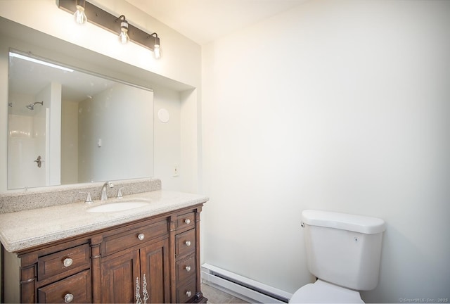 bathroom with toilet, baseboard heating, a shower, and vanity
