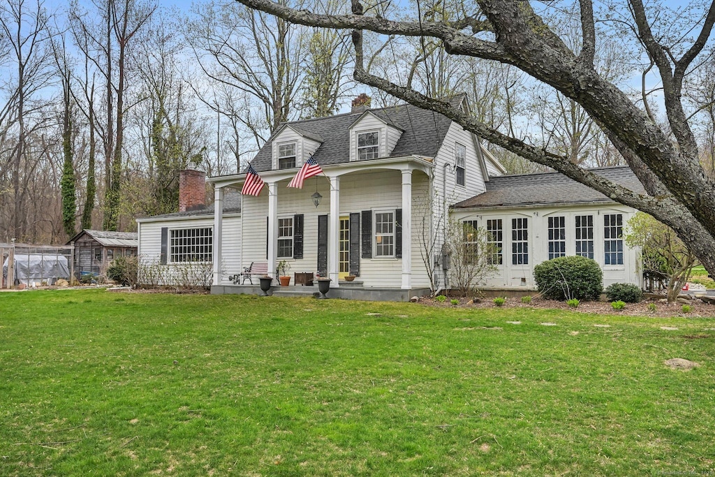 2214 Huntington Tpke, Trumbull, CT 06611 - rear view of property featuring a chimney, roof with shingles, and a yard
