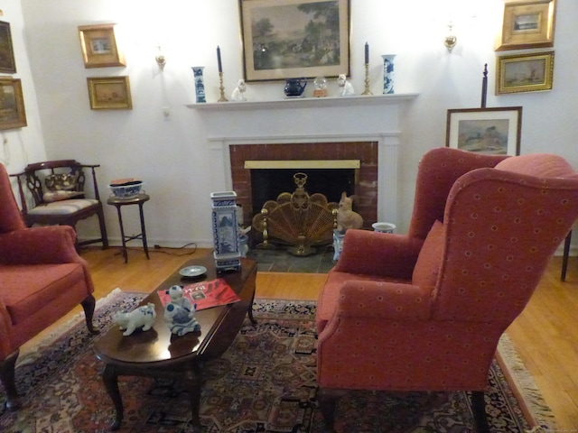 48 Renshaw Rd, Hamden, CT 06518 - living room with wood finished floors and a fireplace with flush hearth