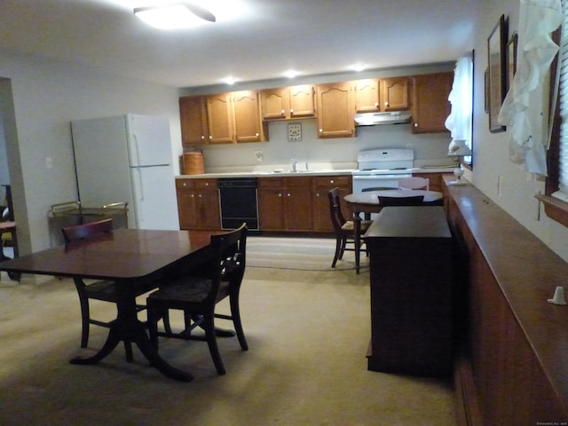 48 Renshaw Rd, Hamden, CT 06518 - kitchen with white appliances, under cabinet range hood, a sink, light countertops, and light colored carpet