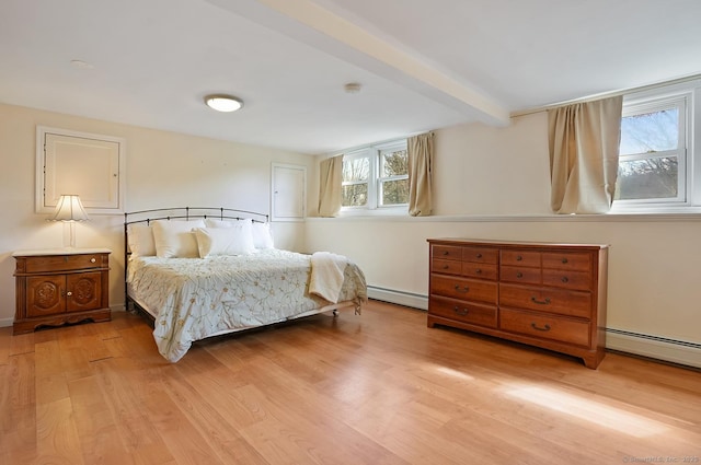 bedroom featuring a baseboard radiator, beamed ceiling, and light wood-type flooring