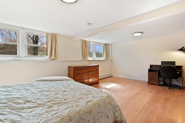 bedroom with light wood-type flooring, a baseboard heating unit, baseboards, and beam ceiling