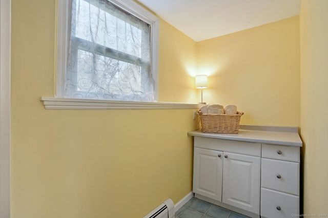 interior space featuring tile patterned floors and baseboards