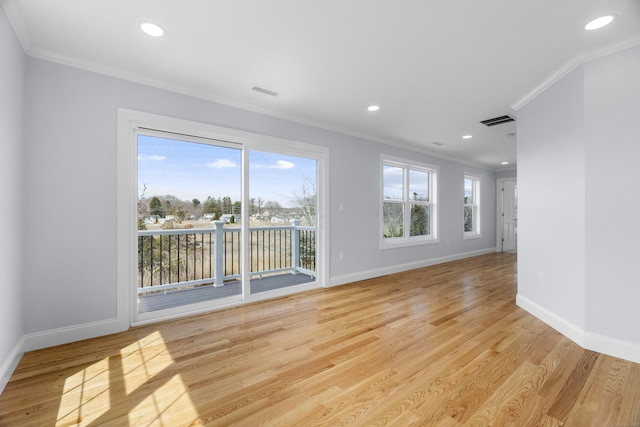 unfurnished living room with crown molding, visible vents, and baseboards