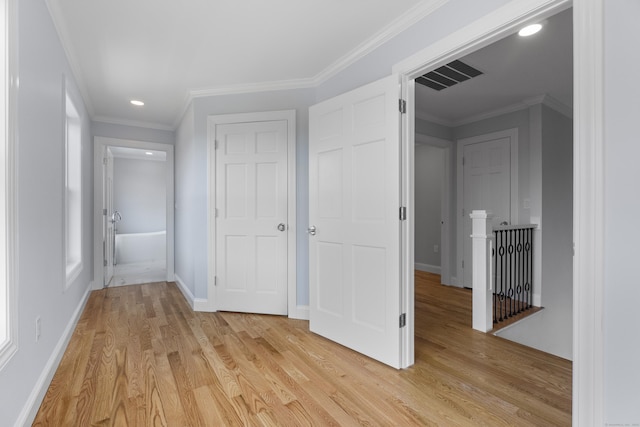 corridor featuring light wood-type flooring, baseboards, recessed lighting, an upstairs landing, and visible vents