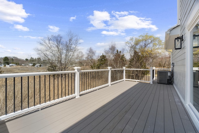 wooden terrace featuring cooling unit