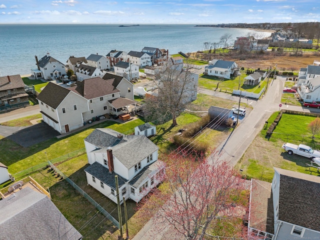 drone / aerial view featuring a residential view and a water view
