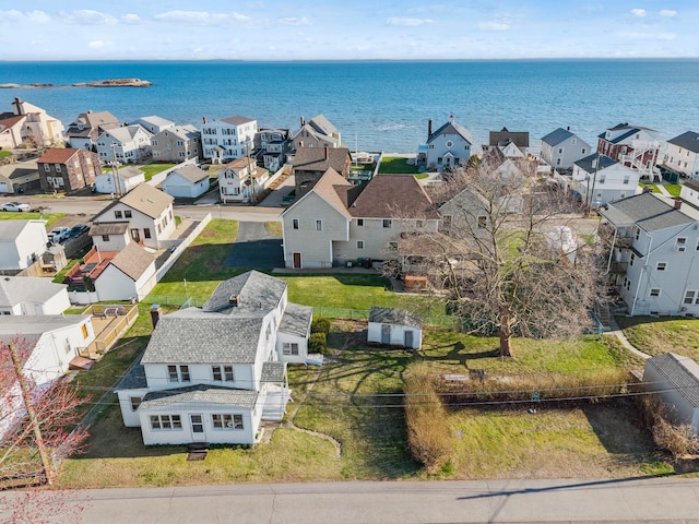 drone / aerial view featuring a residential view and a water view