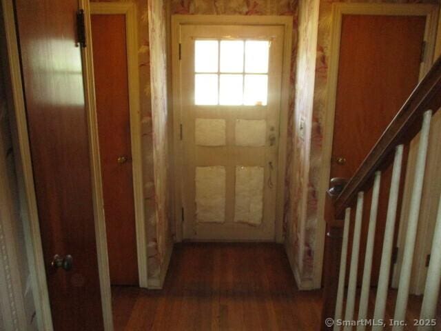 entryway with wood finished floors