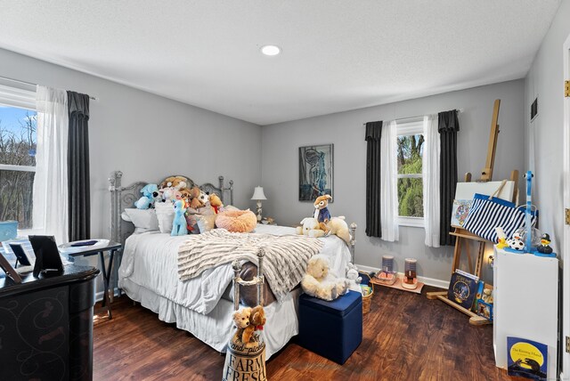 bedroom featuring recessed lighting and wood finished floors