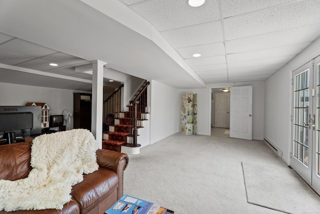 living room featuring recessed lighting, light colored carpet, a baseboard heating unit, stairway, and a paneled ceiling