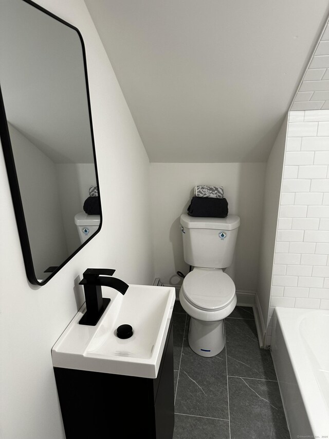 384 Sylvan Ave, Waterbury, CT 06706 - full bath featuring toilet, vanity, a bathtub, a shower, and lofted ceiling