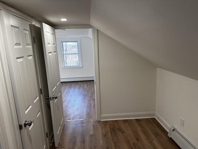 384 Sylvan Ave, Waterbury, CT 06706 - bonus room featuring a baseboard heating unit, a baseboard radiator, vaulted ceiling, dark wood-style floors, and baseboards