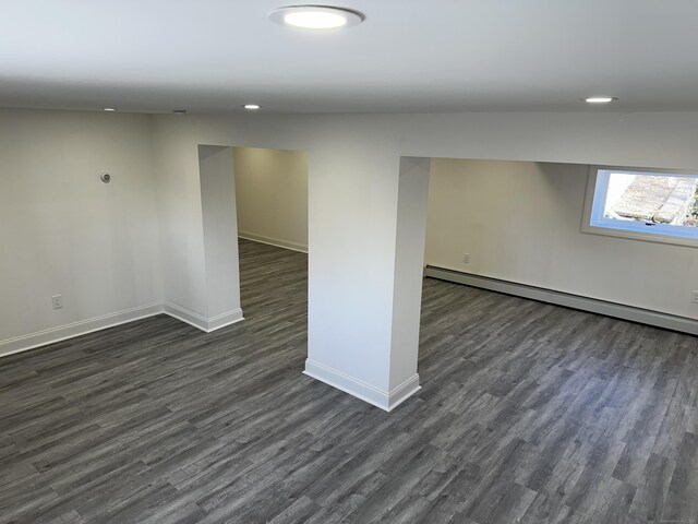 384 Sylvan Ave, Waterbury, CT 06706 - spare room with baseboards, dark wood-type flooring, a baseboard radiator, and recessed lighting