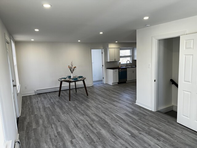 384 Sylvan Ave, Waterbury, CT 06706 - kitchen featuring stainless steel dishwasher, recessed lighting, dark countertops, a baseboard heating unit, and a sink