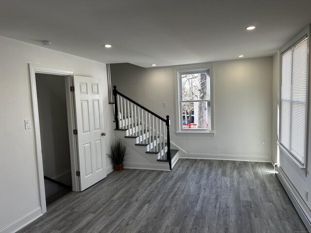 384 Sylvan Ave, Waterbury, CT 06706 - foyer with a baseboard radiator, dark wood-style floors, stairway, recessed lighting, and baseboards