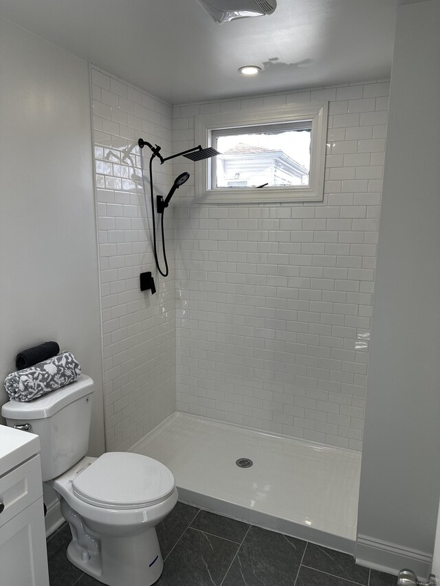 384 Sylvan Ave, Waterbury, CT 06706 - bathroom with a stall shower, toilet, and tile patterned flooring