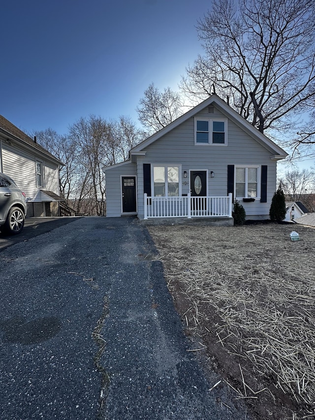 384 Sylvan Ave, Waterbury, CT 06706 - bungalow-style house featuring covered porch and asphalt driveway