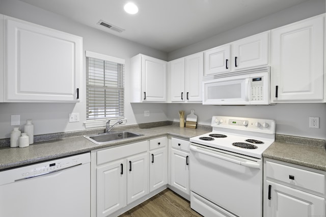 49 Glenbrook Rd Apt 209, Stamford, CT 06902 - kitchen with white cabinets, a sink, white appliances, and visible vents