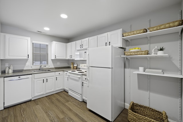 49 Glenbrook Rd Apt 209, Stamford, CT 06902 - kitchen featuring recessed lighting, white appliances, open shelves, a sink, and wood finished floors