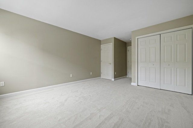 49 Glenbrook Rd Apt 209, Stamford, CT 06902 - unfurnished bedroom with a closet, baseboards, and light carpet