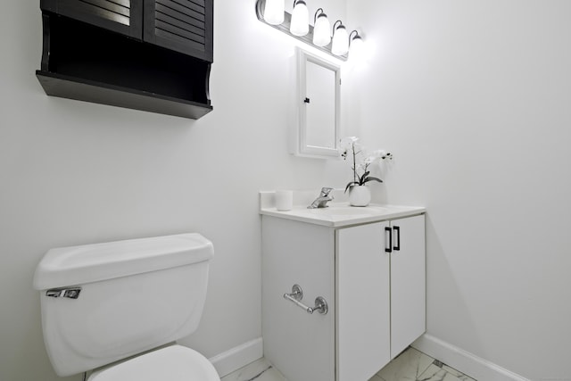 49 Glenbrook Rd Apt 209, Stamford, CT 06902 - bathroom with marble finish floor, vanity, baseboards, and toilet