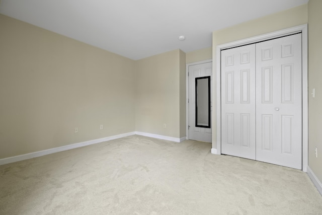 49 Glenbrook Rd Apt 209, Stamford, CT 06902 - unfurnished bedroom featuring a closet, baseboards, and light carpet