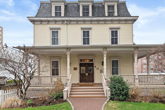 49 Glenbrook Rd Apt 209, Stamford, CT 06902 - second empire-style home with a porch, a high end roof, fence, and mansard roof