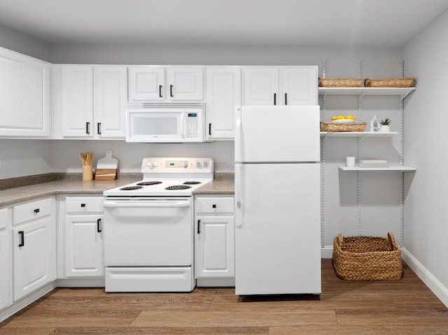 49 Glenbrook Rd Apt 209, Stamford, CT 06902 - kitchen featuring light wood-style floors, light countertops, white appliances, and white cabinets