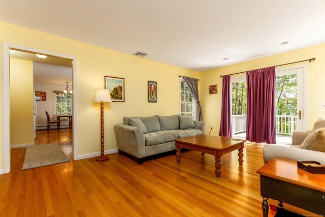 2 Cassella Dr, Wallingford, CT 06492 - living room featuring light wood finished floors, plenty of natural light, and baseboards