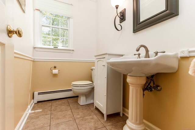 2 Cassella Dr, Wallingford, CT 06492 - bathroom with baseboard heating, toilet, tile patterned flooring, and baseboards